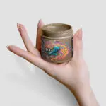 Project M Deep Sea Mud Lady Holding an Open pot