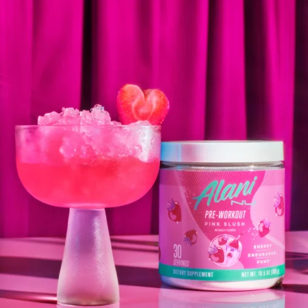 Alani Nu Pre Workout - Pink Slush Promotional Image - Poured in a glass