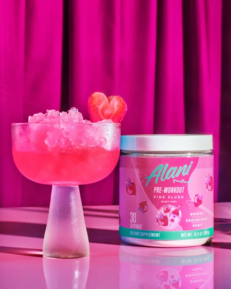 Alani Nu Pre Workout - Pink Slush Promotional Image - Poured in a glass