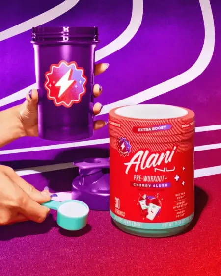 Alani NU Pre-Workout + Cherry Slush Flavour- Lifestyle Image